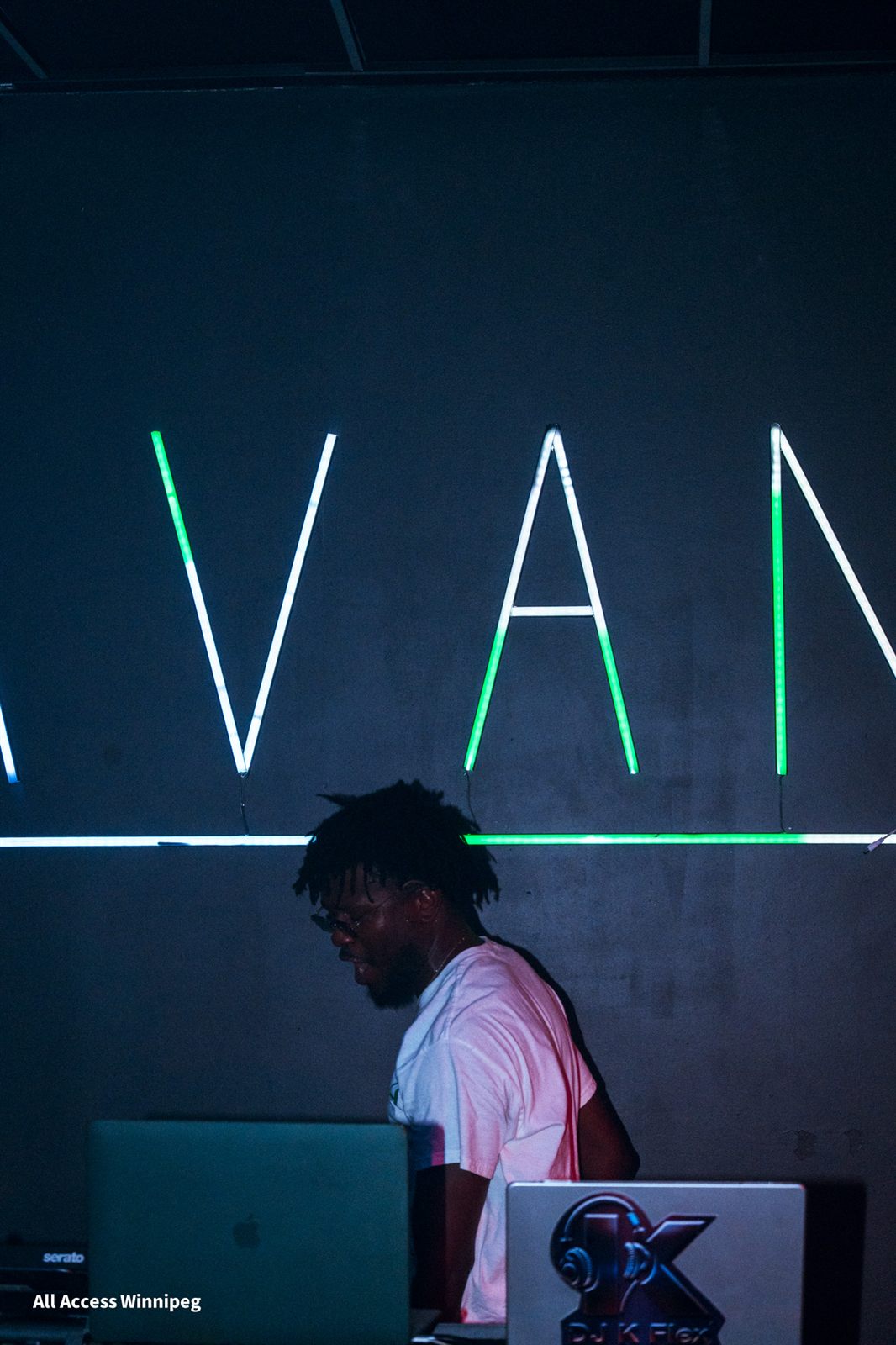 DJ Saint portrait under neon signage, Casa Blanca, Winnipeg