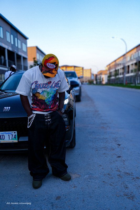 P0PS leaning on a car at dusk, P0PS x FOLA night, Winnipeg