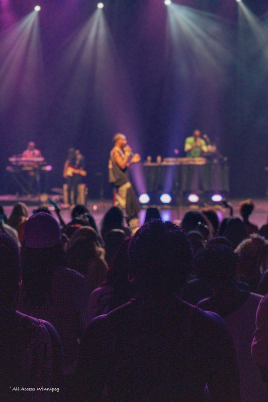 Artist performing under purple stage lights, P0PS x Young Jonn, Winnipeg