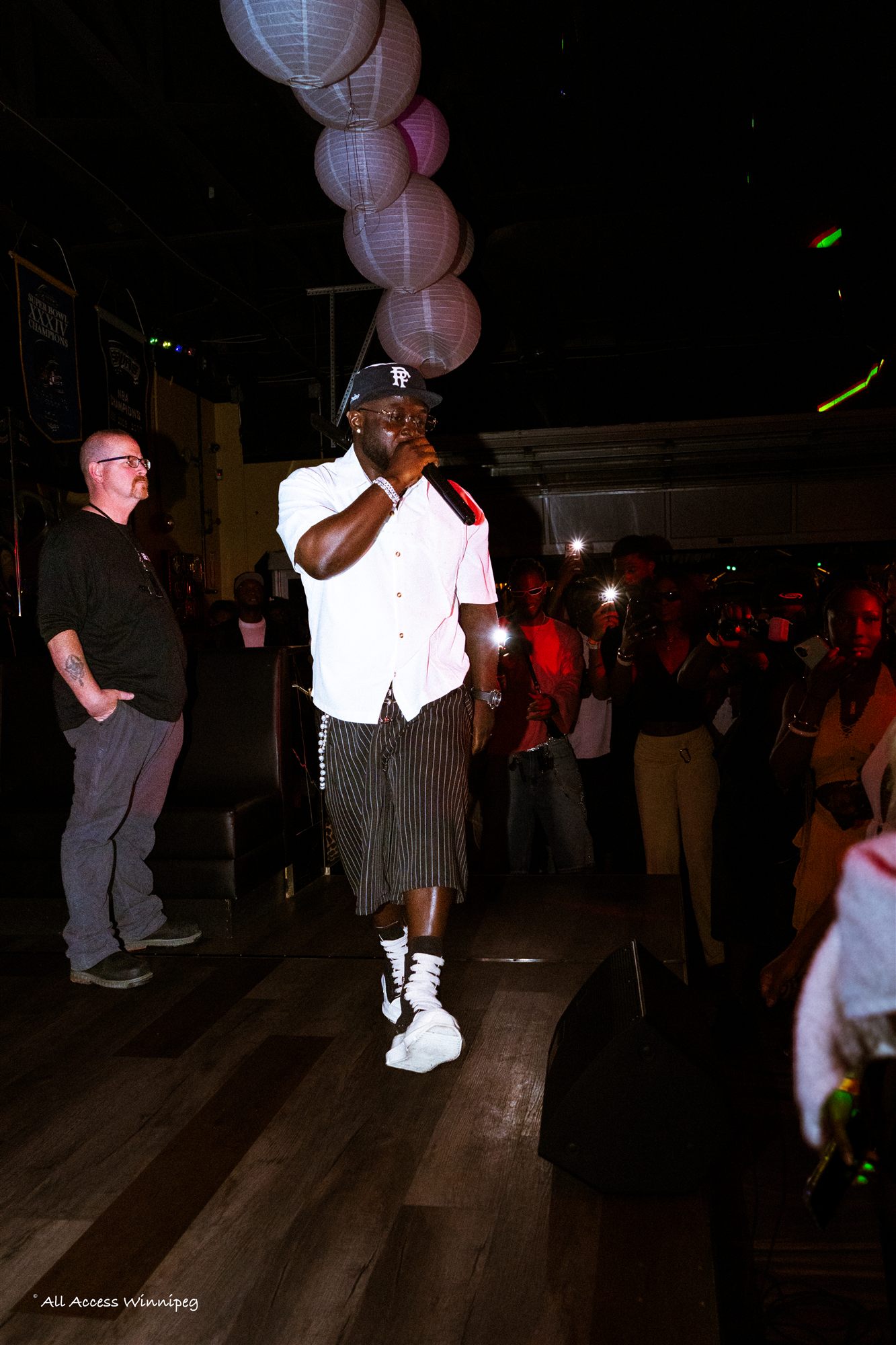 Host performing on stage, NO11 opening night, Winnipeg