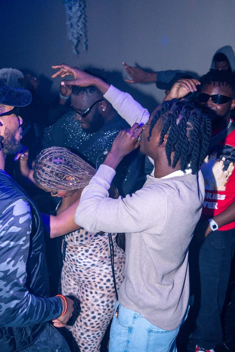 Guests packed onto the dance floor, one in a leopard-print outfit