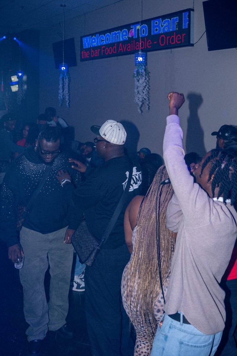Crowd dancing, a guest with a fist in the air