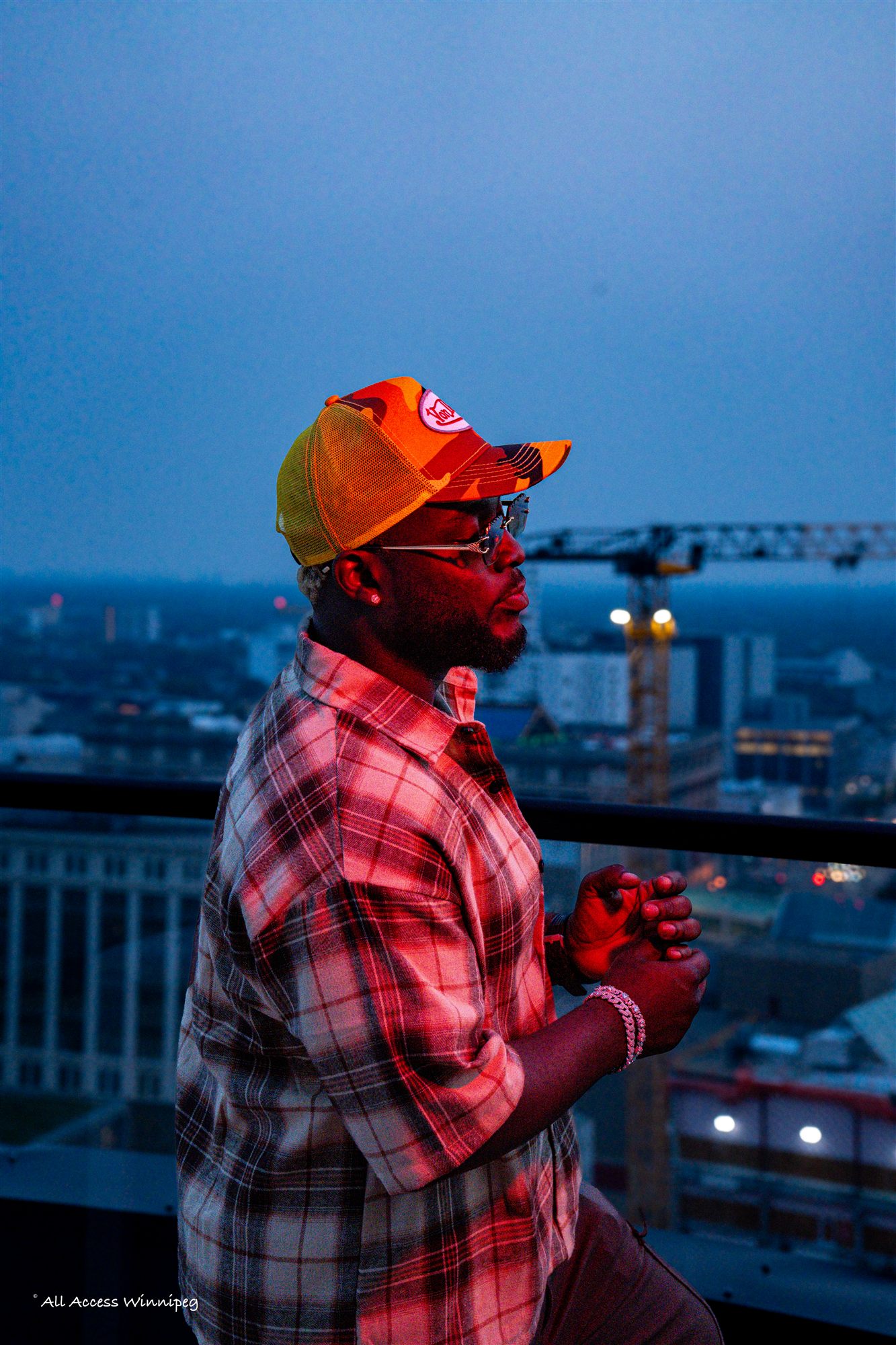 Rooftop portrait at dusk, Winnipeg skyline, Konfam shoot