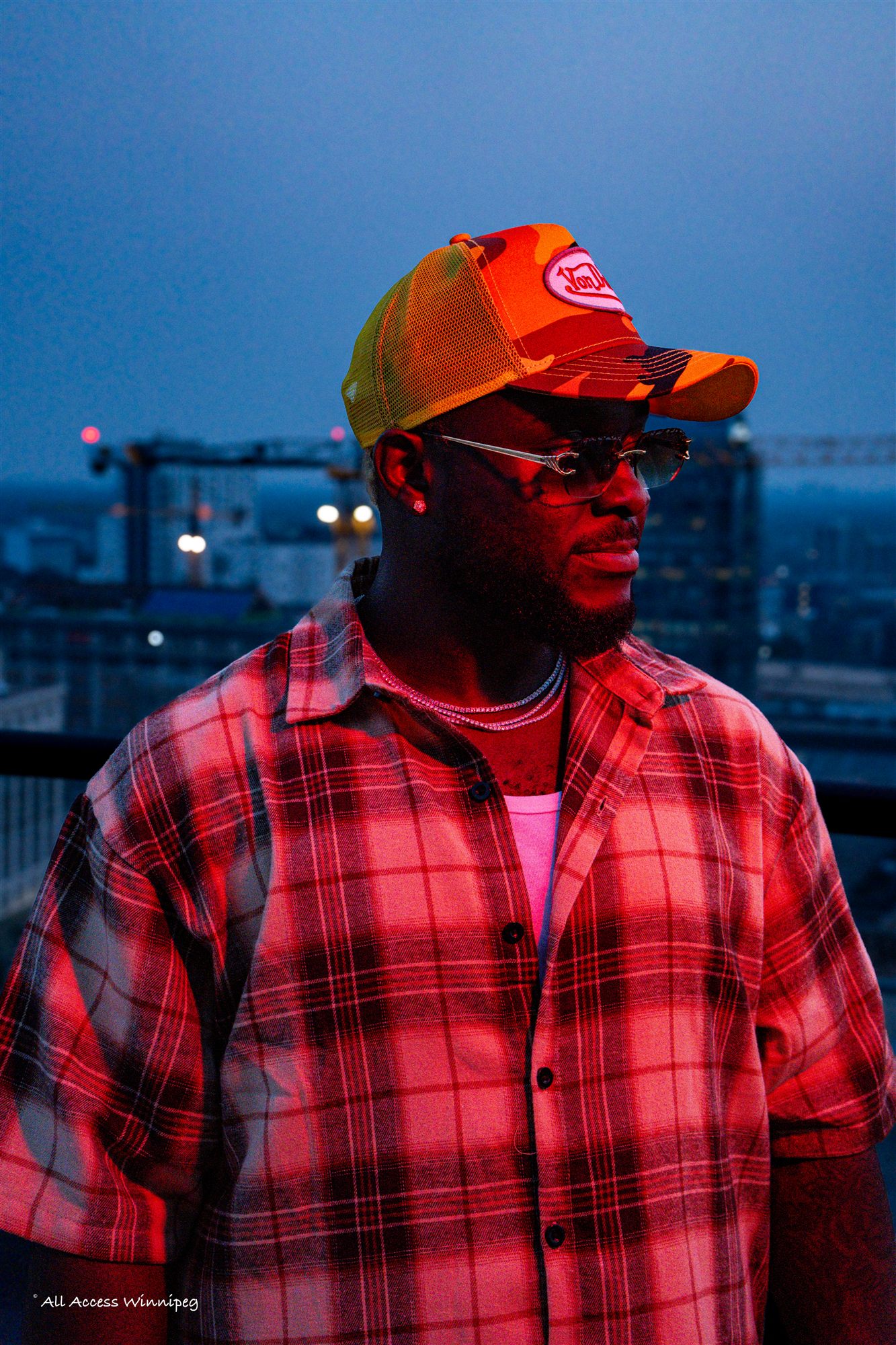 Rooftop portrait, city lights, Konfam shoot, Winnipeg