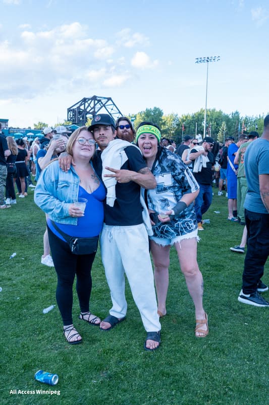Three friends posed together on the festival grounds
